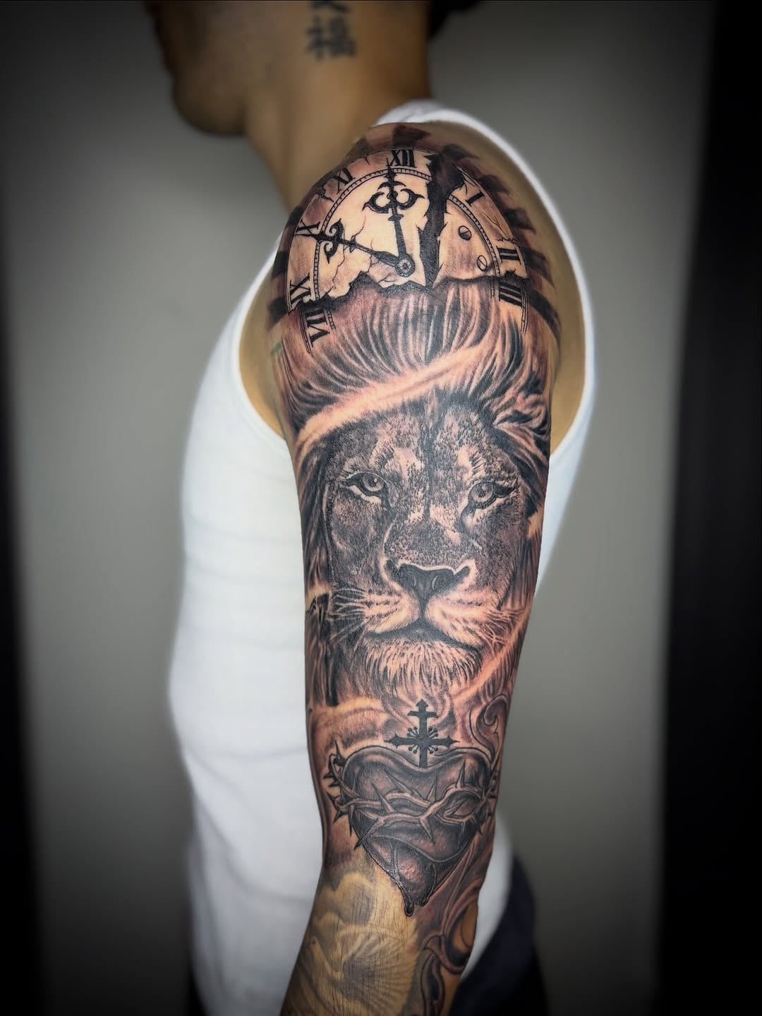 Tattoo by @zhentats2 β realism, black_and_grey