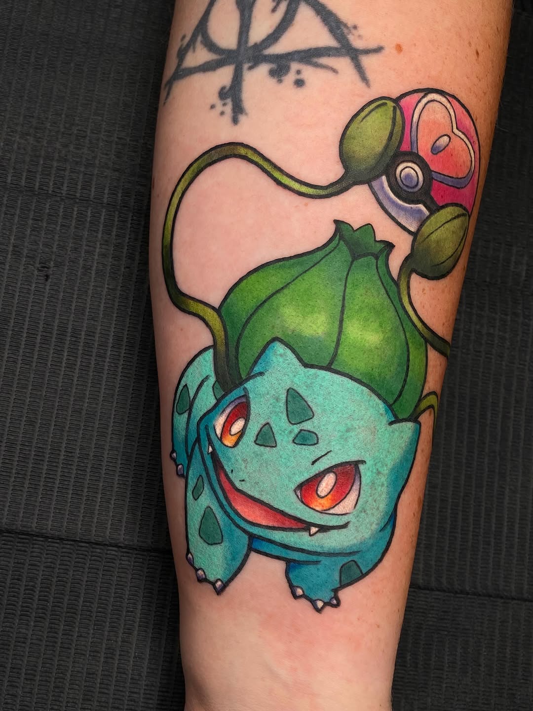 Tattoo by @kaitlin.tattoos — illustrative, anime