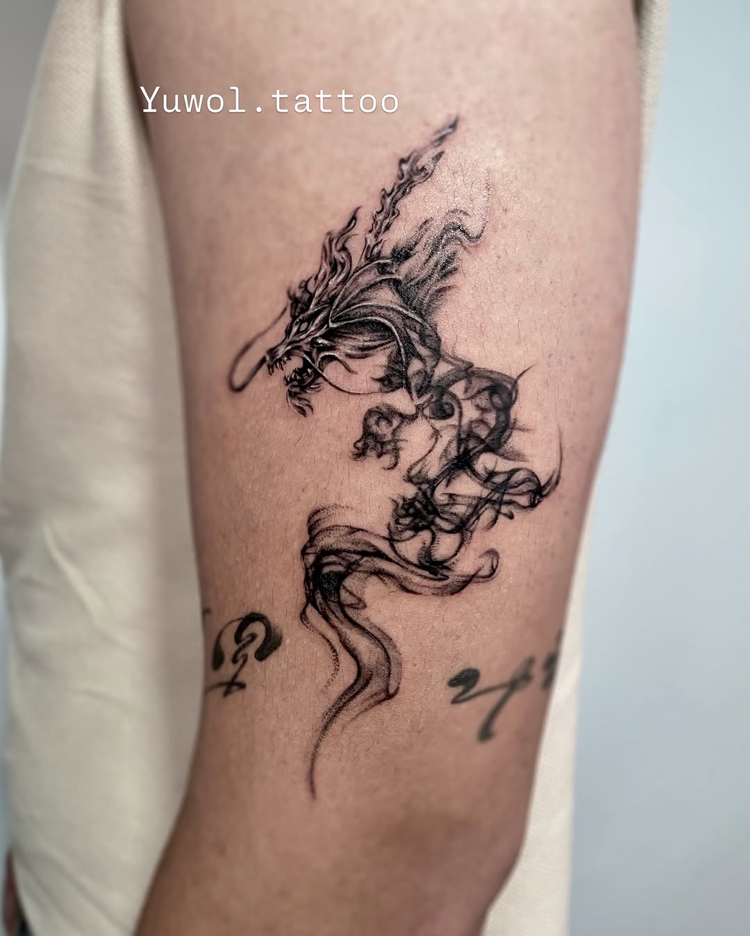 Tattoo by @yuwol.tattoo — black_and_grey, illustrative