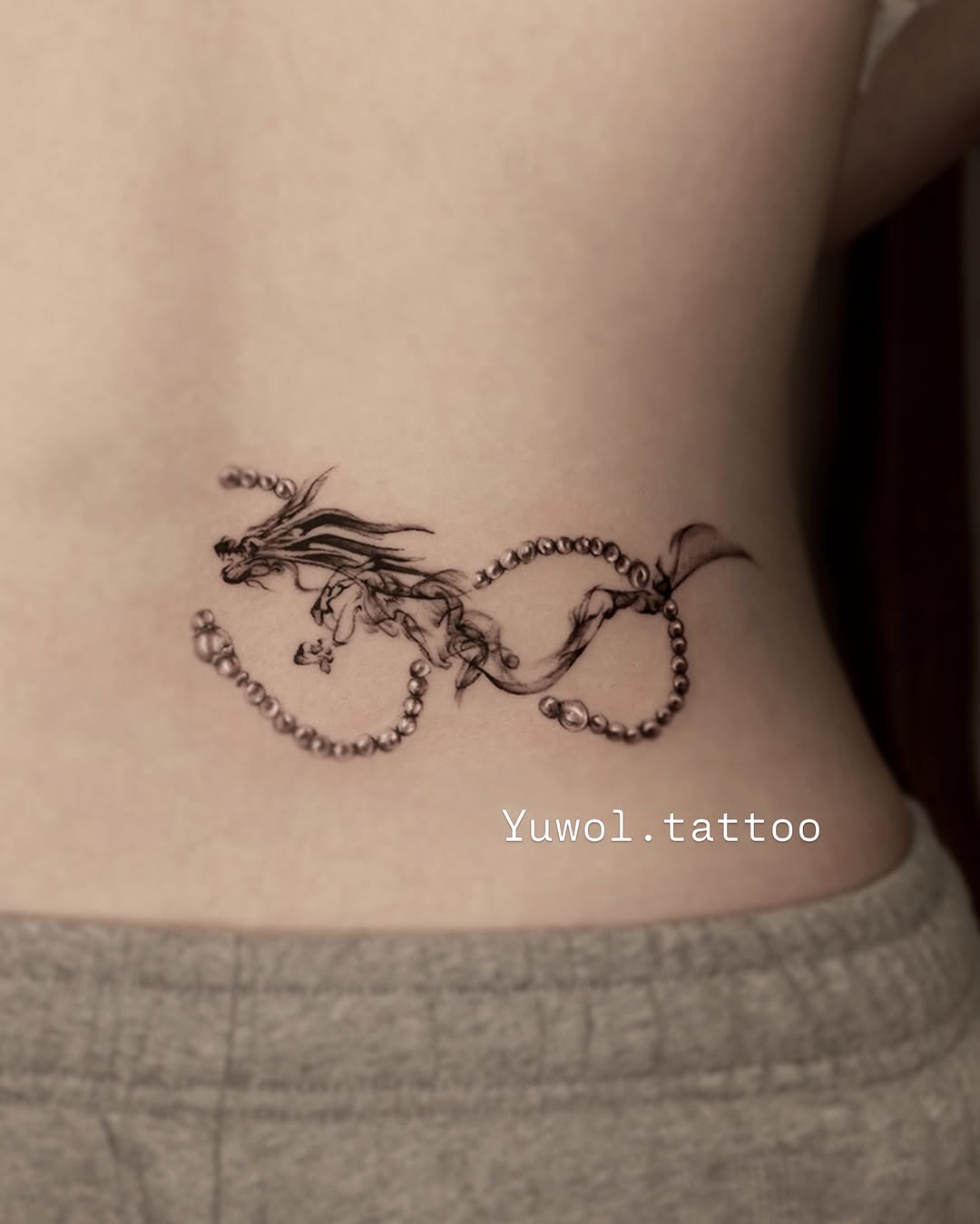 Tattoo by @yuwol.tattoo — fine_line, black_and_grey