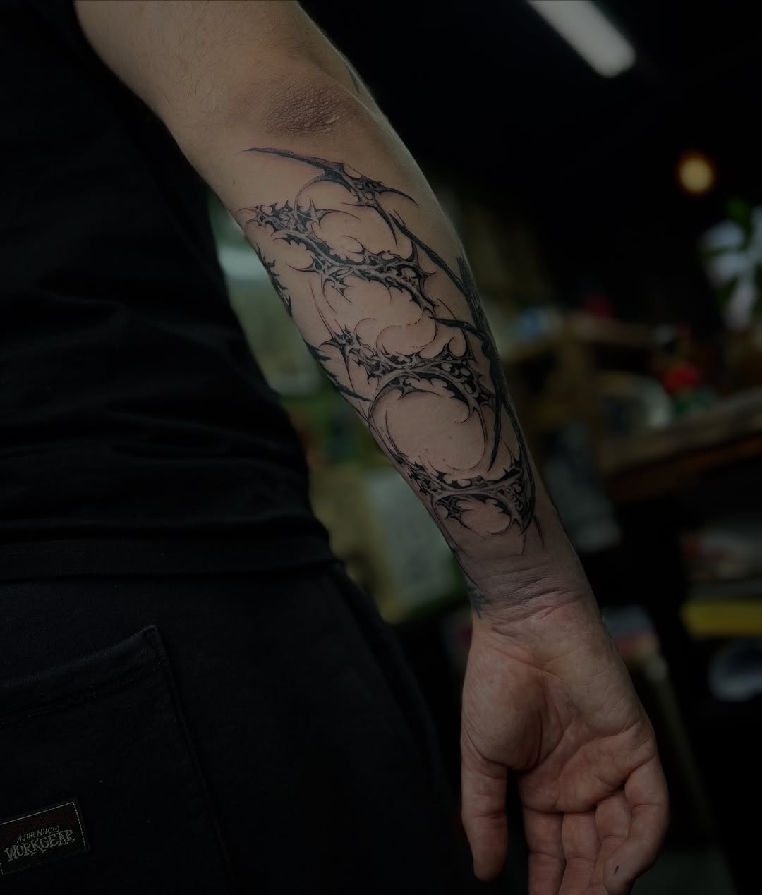 Tattoo by @entity.ttt — blackwork, geometric