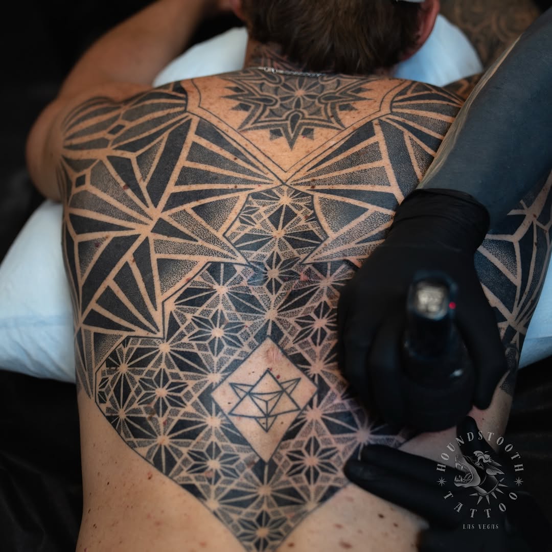 Tattoo by @sacredhound.ttt — geometric, dotwork
