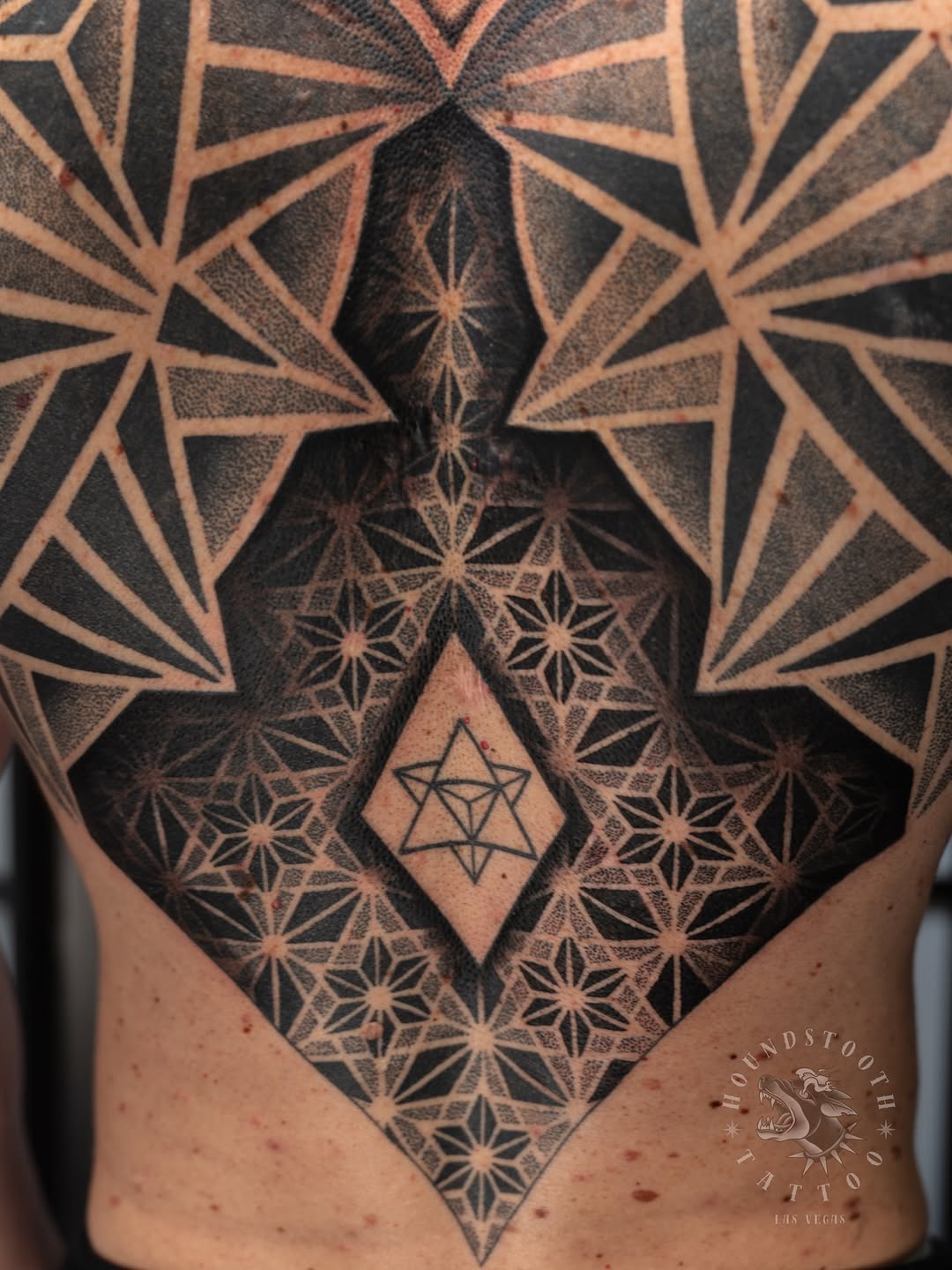 Tattoo by @sacredhound.ttt — geometric, dotwork