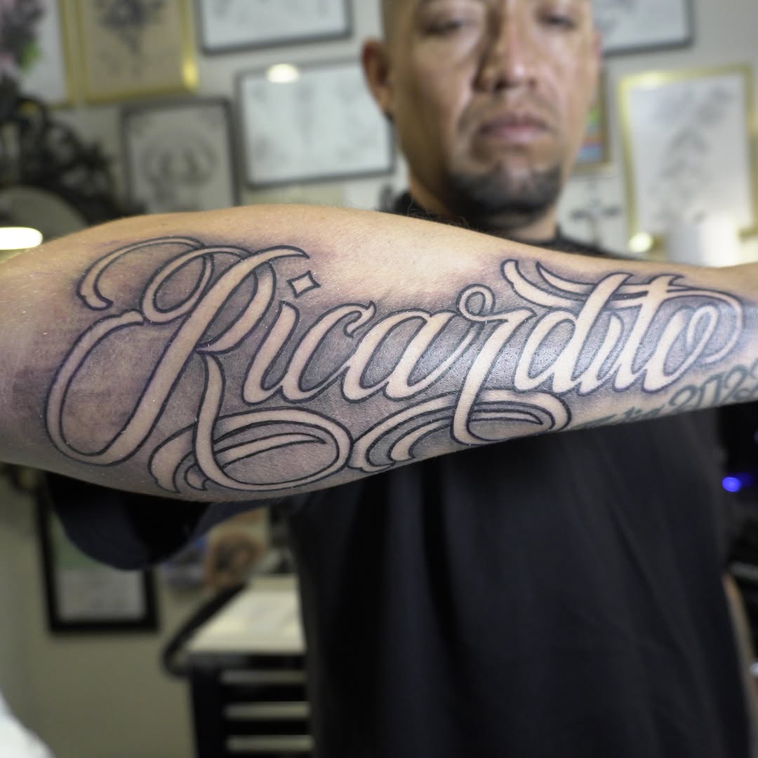Tattoo by @adrian__tattoos — lettering_script, chicano