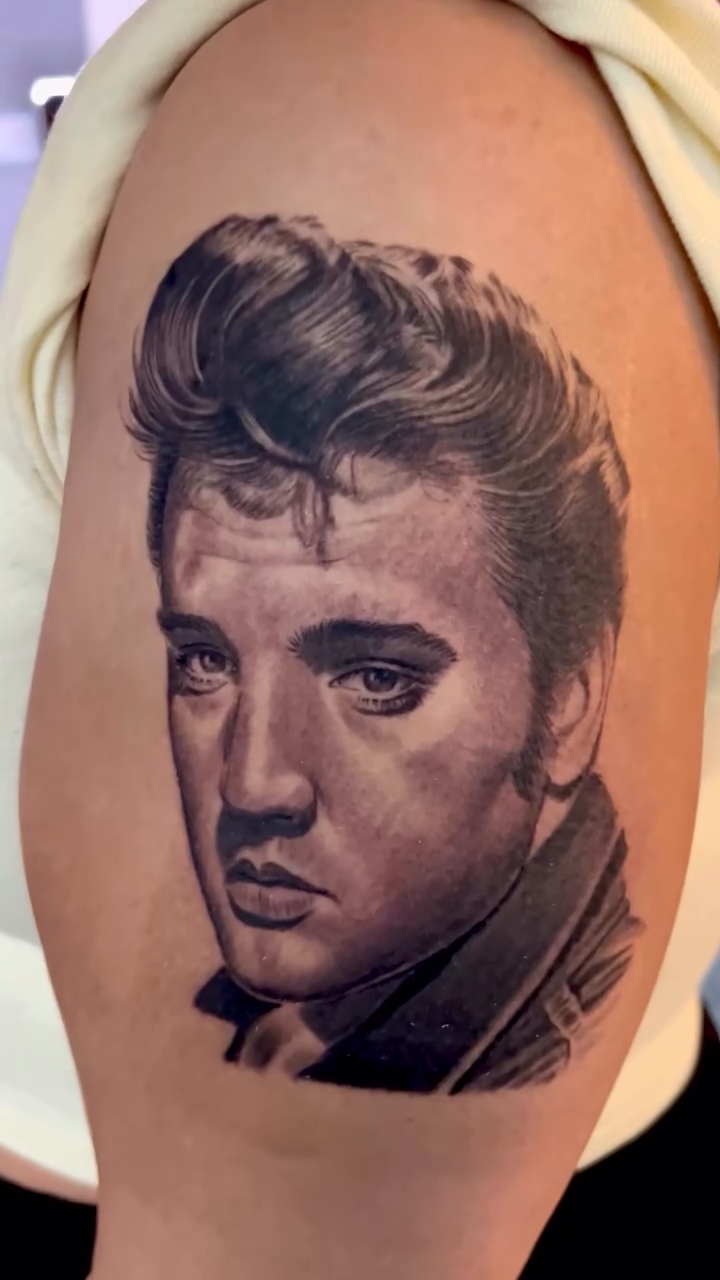 Tattoo by @carlos__macedo โ realism, black_and_grey