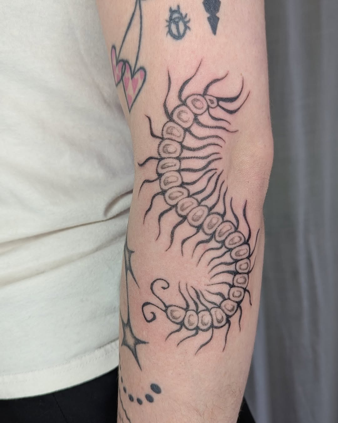 Tattoo by @sluggybunny — illustrative, blackwork