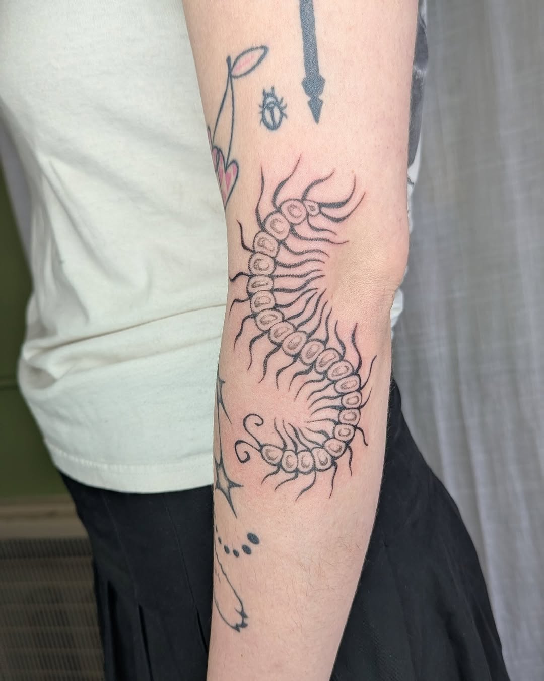 Tattoo by @sluggybunny — illustrative, blackwork
