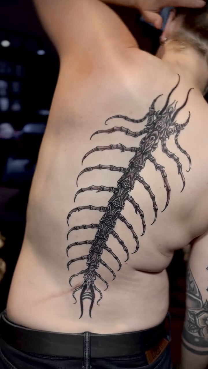 Tattoo by @tat.suey.ink — blackwork, black_and_grey