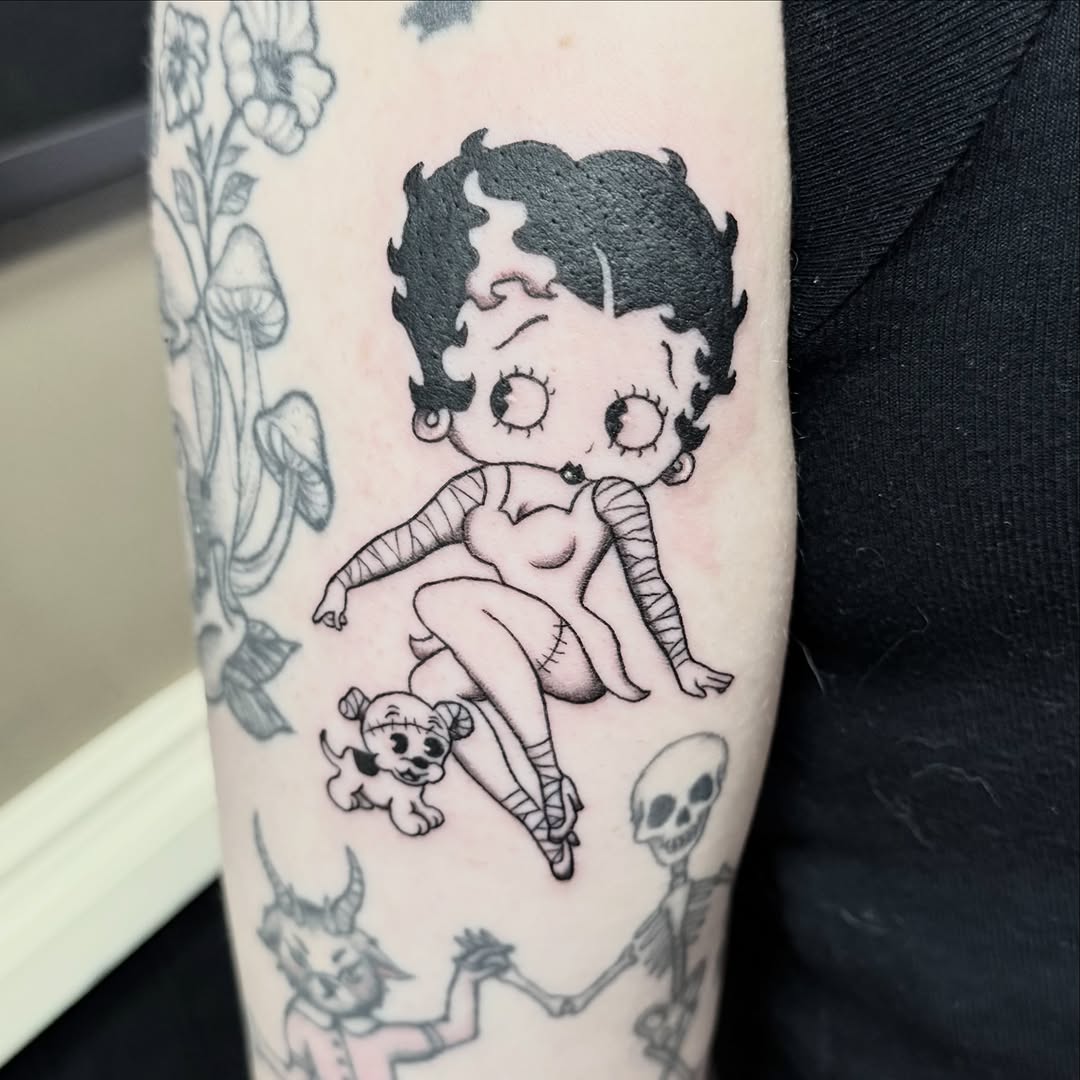 Tattoo by @lizglitztattoo — illustrative, blackwork