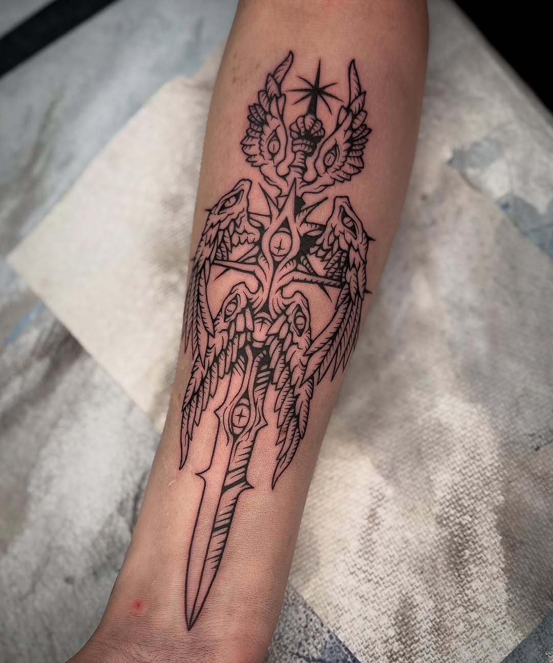 Tattoo by @trash.wizard — illustrative, blackwork