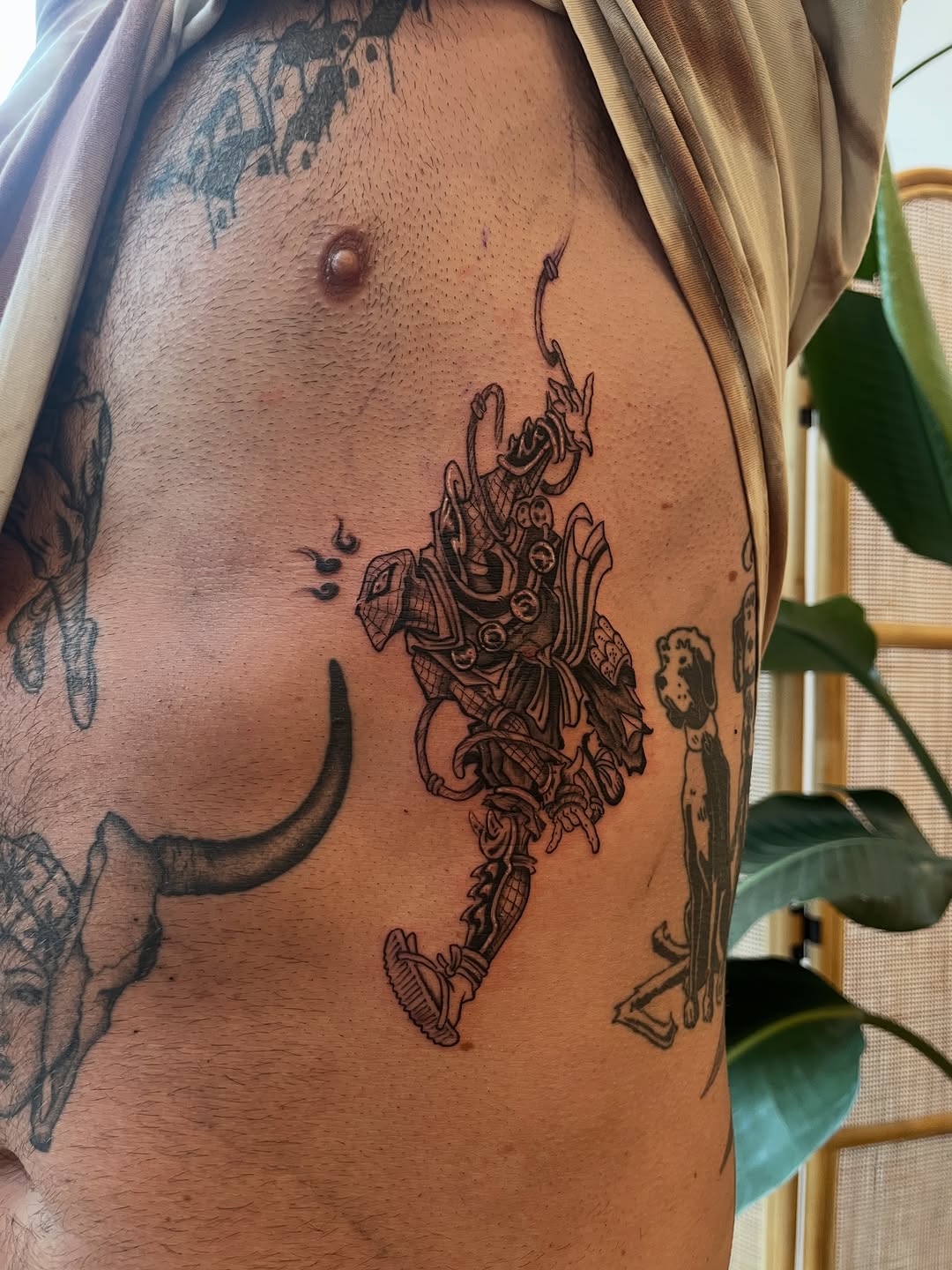 Tattoo by @long.ung — illustrative, blackwork