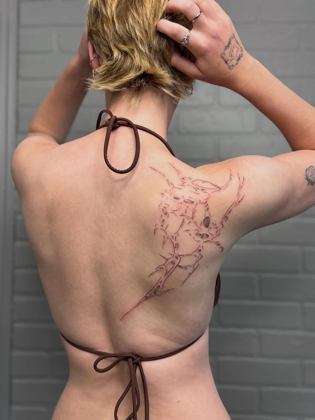 Tattoo by @vaehinked — illustrative, blackwork