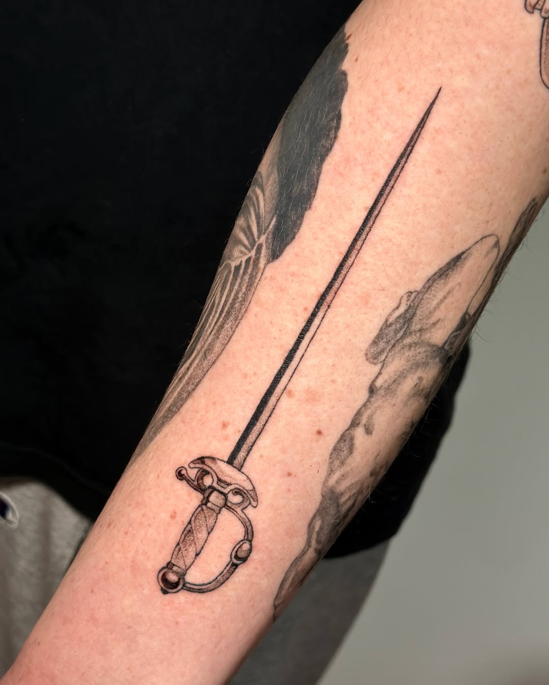 Tattoo by @tattoo.olive — black_and_grey, illustrative