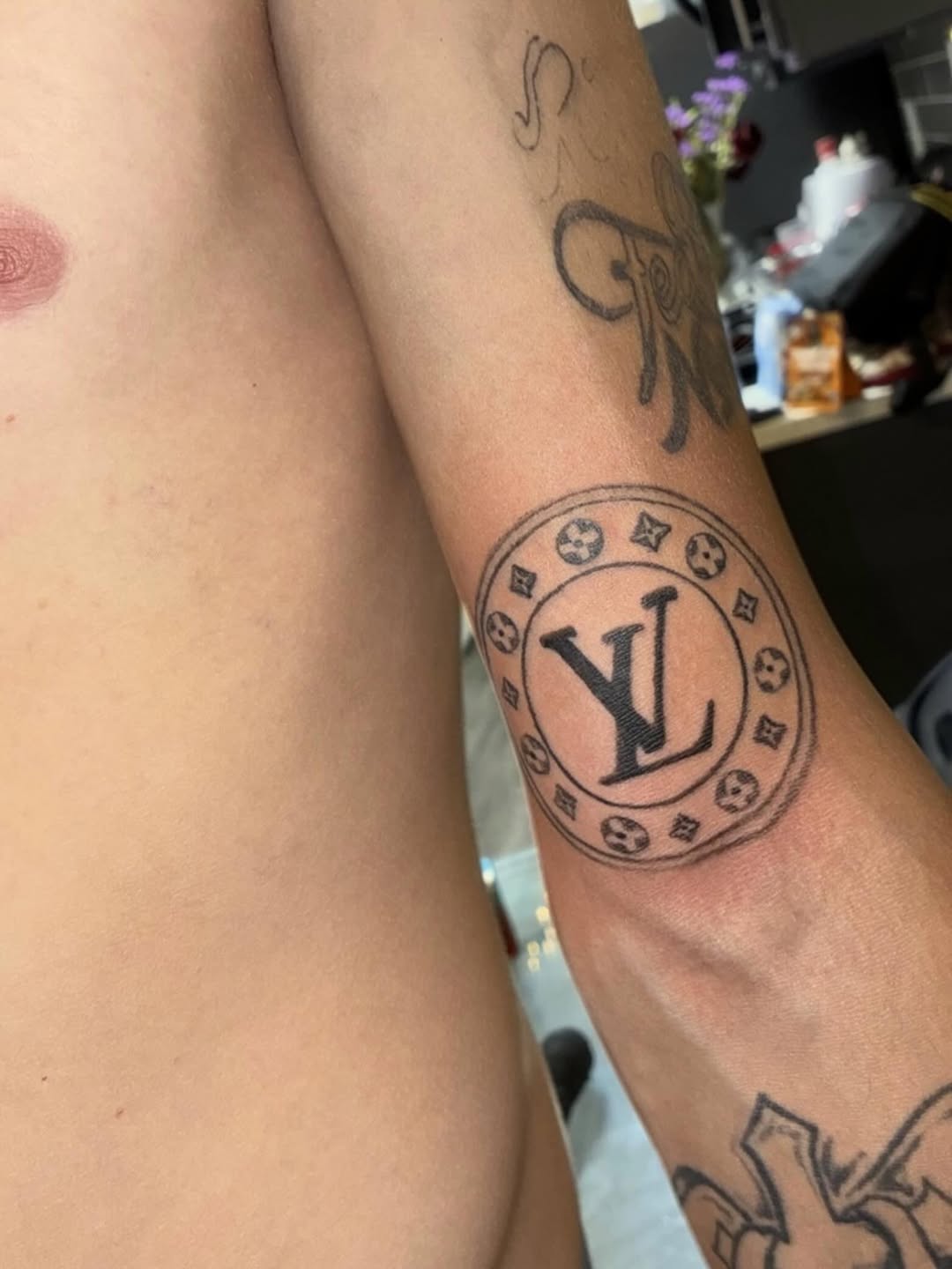 Tattoo by @702tattoo — illustrative, blackwork