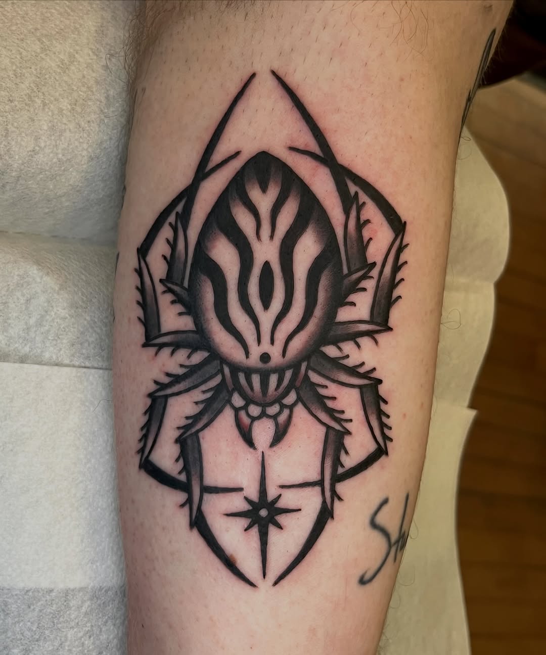 Tattoo by @sly.tri — illustrative, blackwork