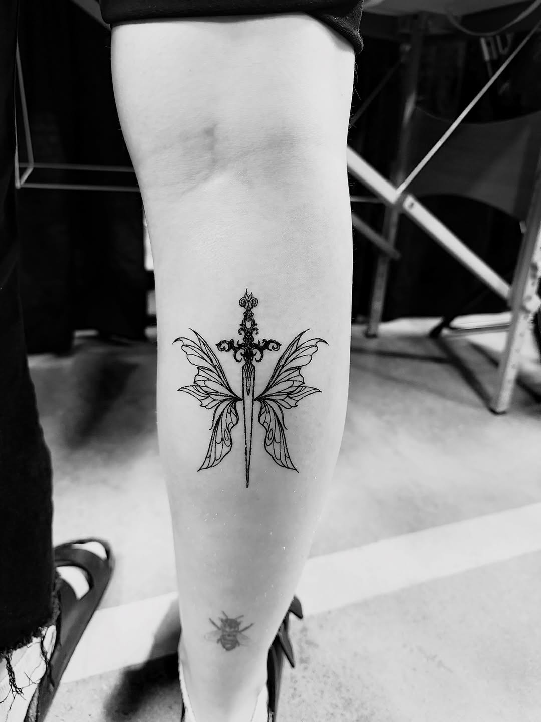 Tattoo by @storylines.tattoos — fine_line, black_and_grey