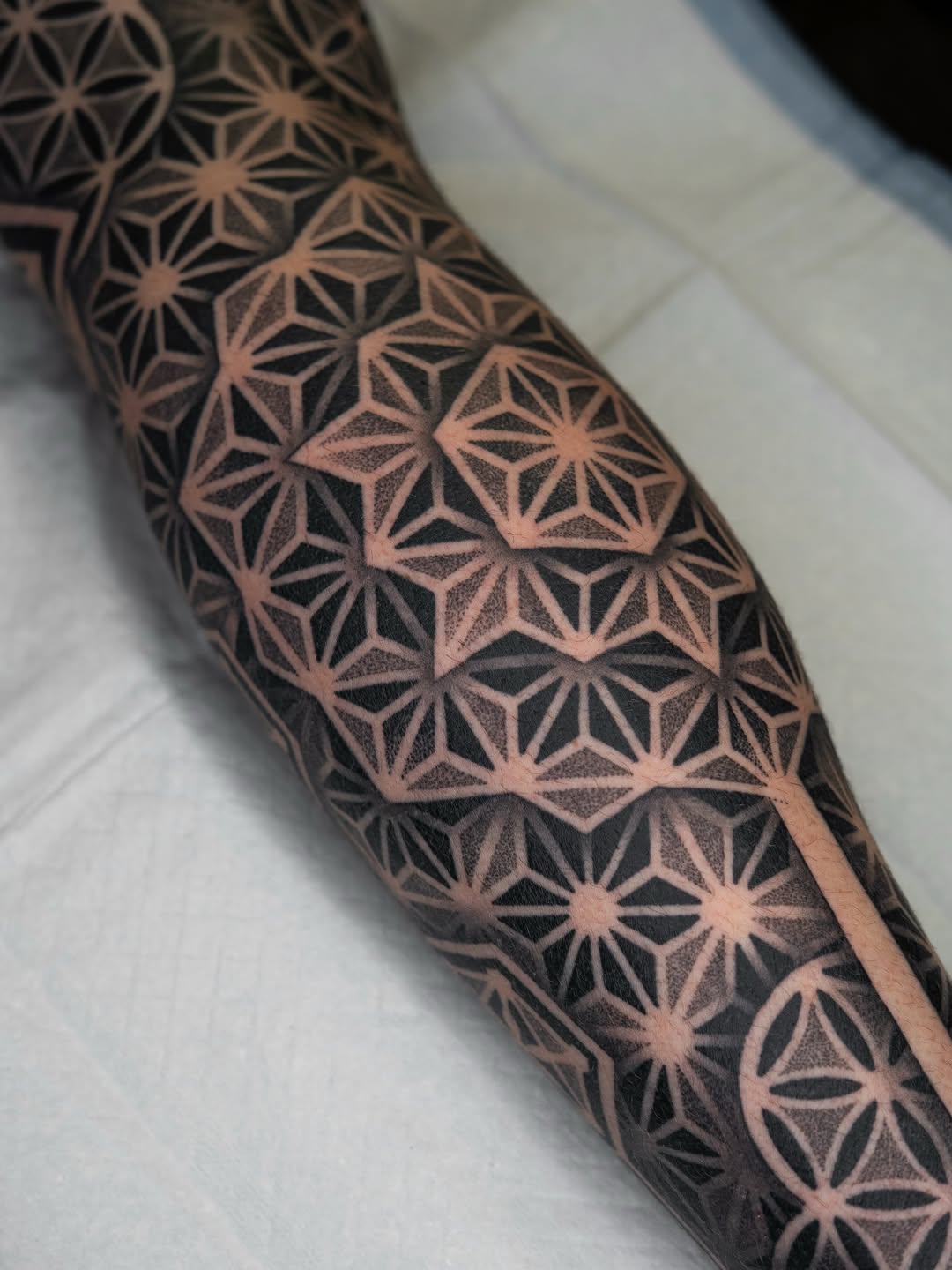 Tattoo by @rjxdots — geometric, dotwork
