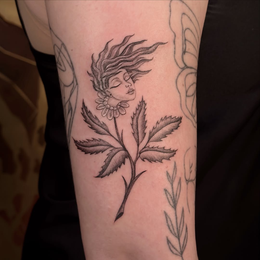 Tattoo by @carmensdarkgallery — black_and_grey, fine_line