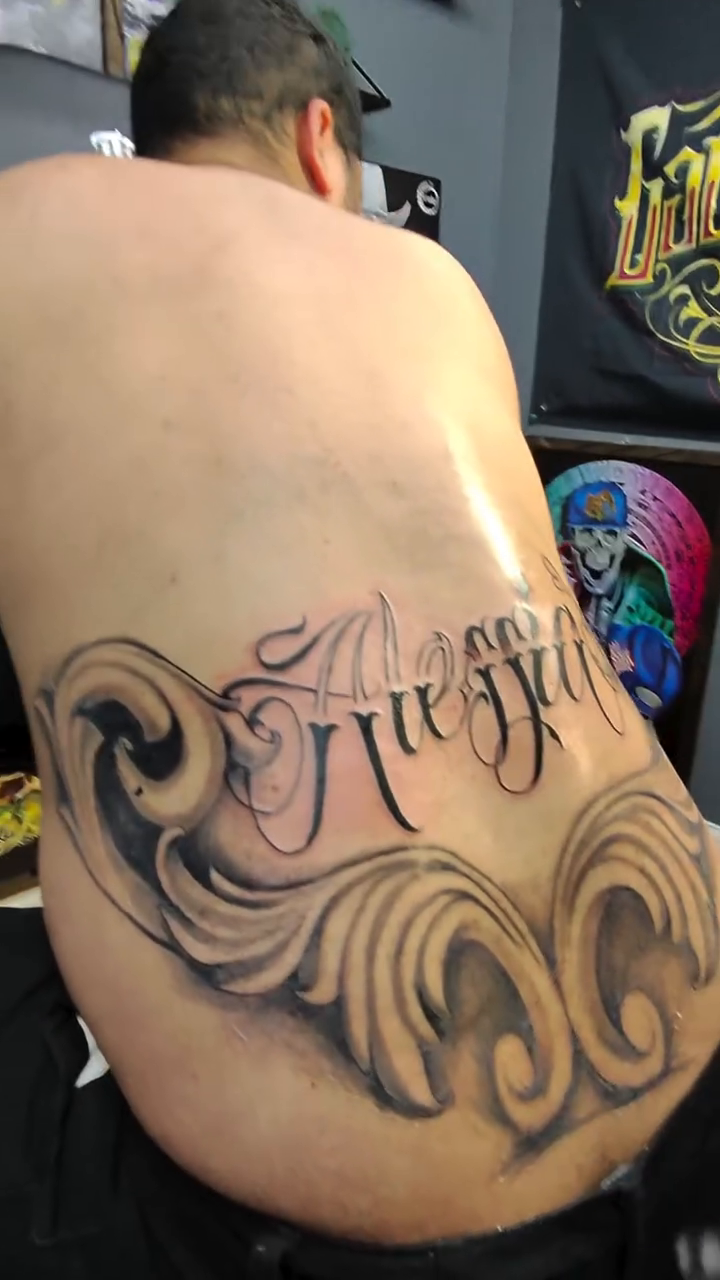 Tattoo by @os_flako — lettering_script, black_and_grey