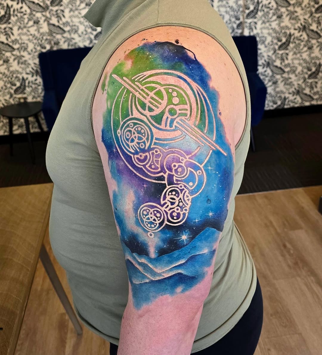 Tattoo by @emilylouisetattoos — watercolor, geometric