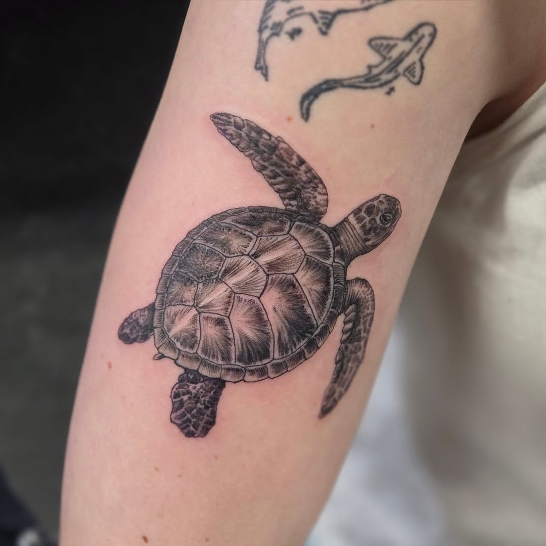 Tattoo by @robg_lovertattoos โ realism, black_and_grey