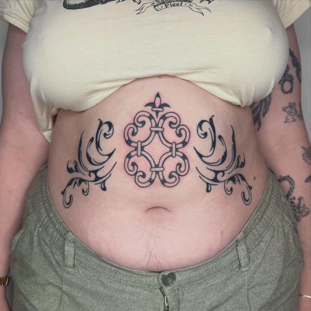 Tattoo by @microwave.00 — ornamental, blackwork