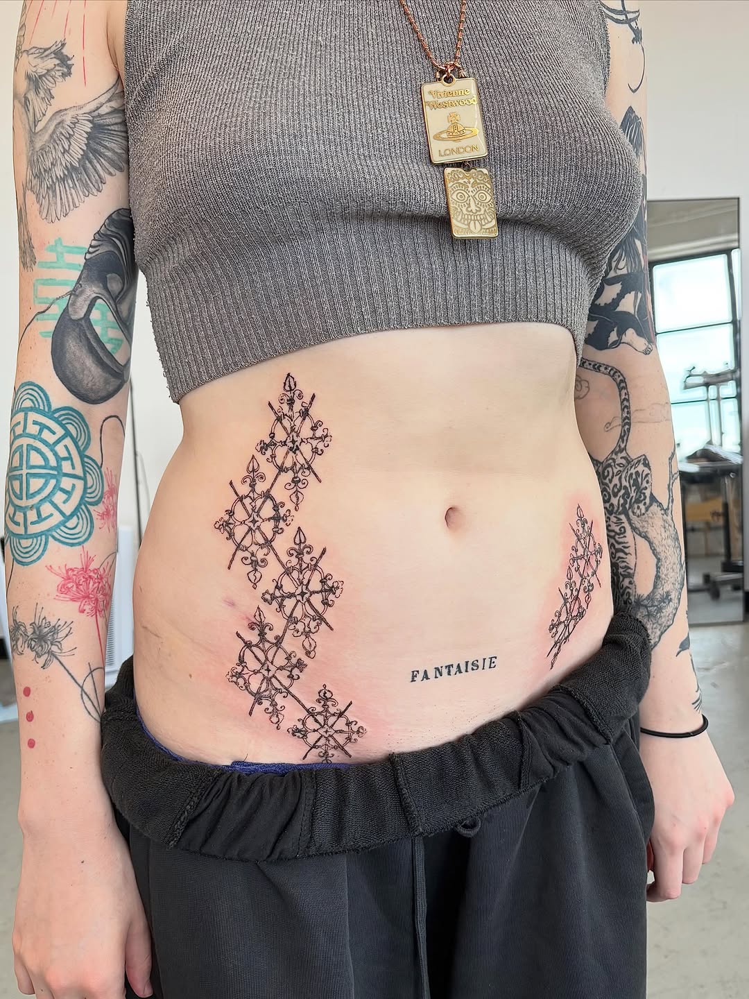 Tattoo by @spikecharms — illustrative, blackwork