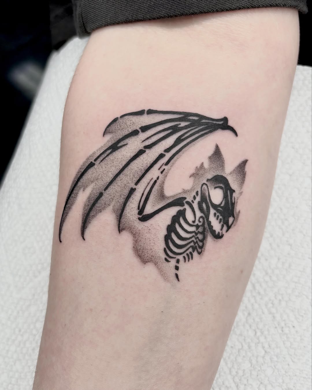 Tattoo by @vang.studio — illustrative, blackwork