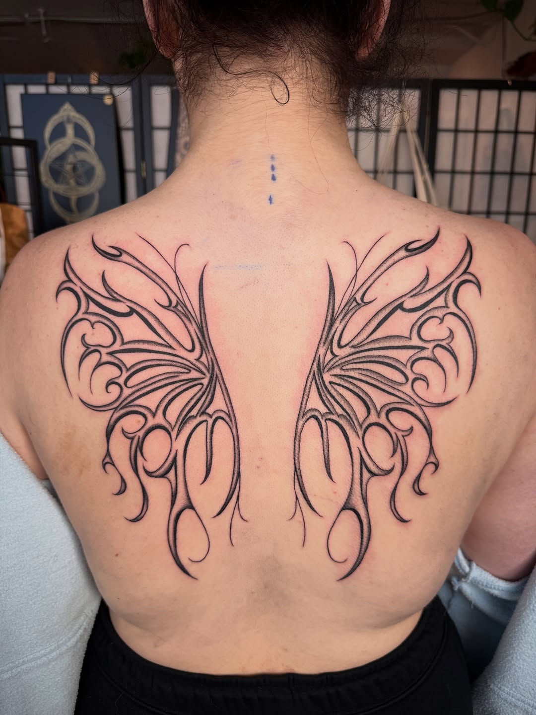 Tattoo by @seenaink — illustrative, blackwork