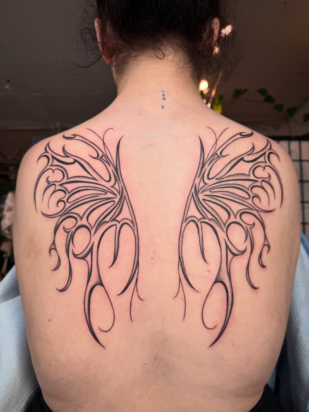 Tattoo by @seenaink — illustrative, blackwork