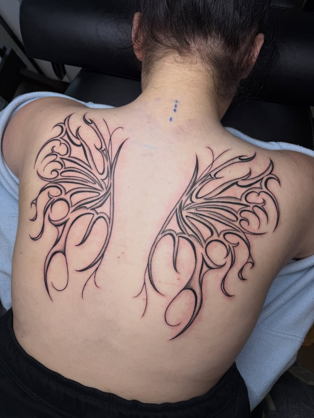 Tattoo by @seenaink — illustrative, blackwork
