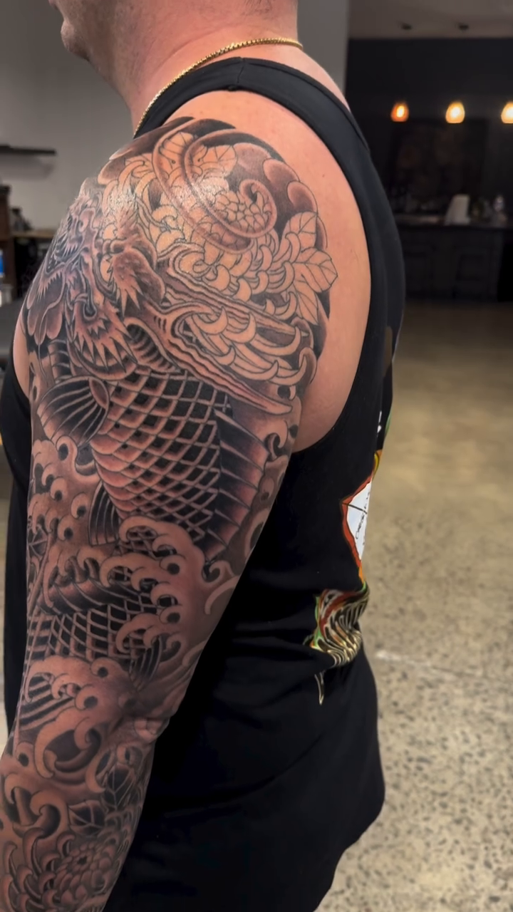 Tattoo by @hunter.schuon.tattoo — japanese_irezumi, black_and_grey
