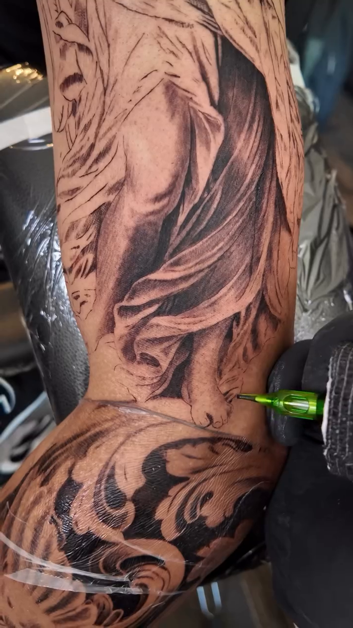 Tattoo by @carlos__macedo โ realism, black_and_grey