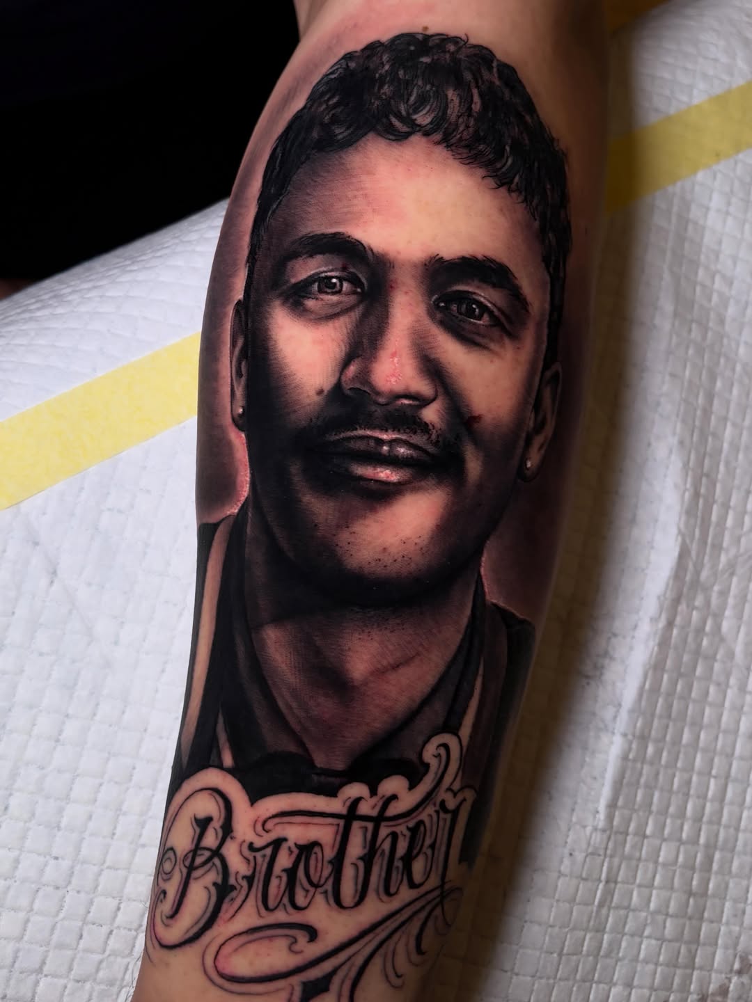 Tattoo by @italoholietattoo — realism, lettering_script