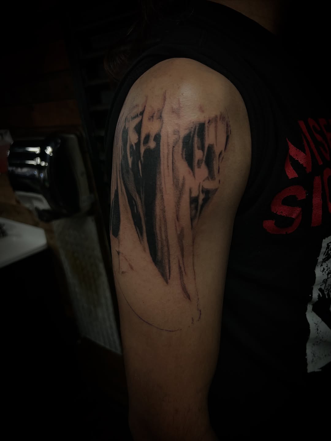 Tattoo by @halfwit__ — dark_realism, black_and_grey