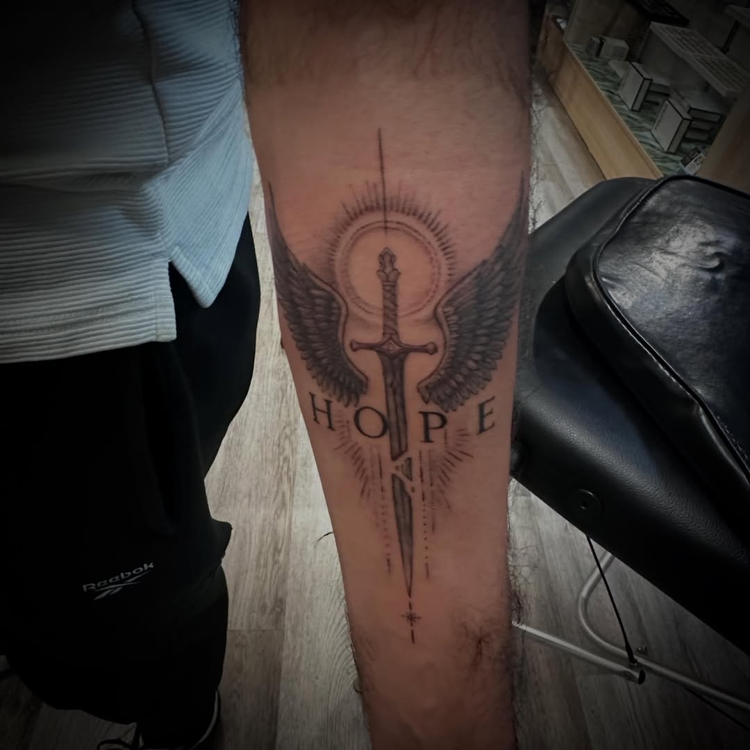 Tattoo by @javier_jimenez_tattoo_ — black_and_grey, lettering_script