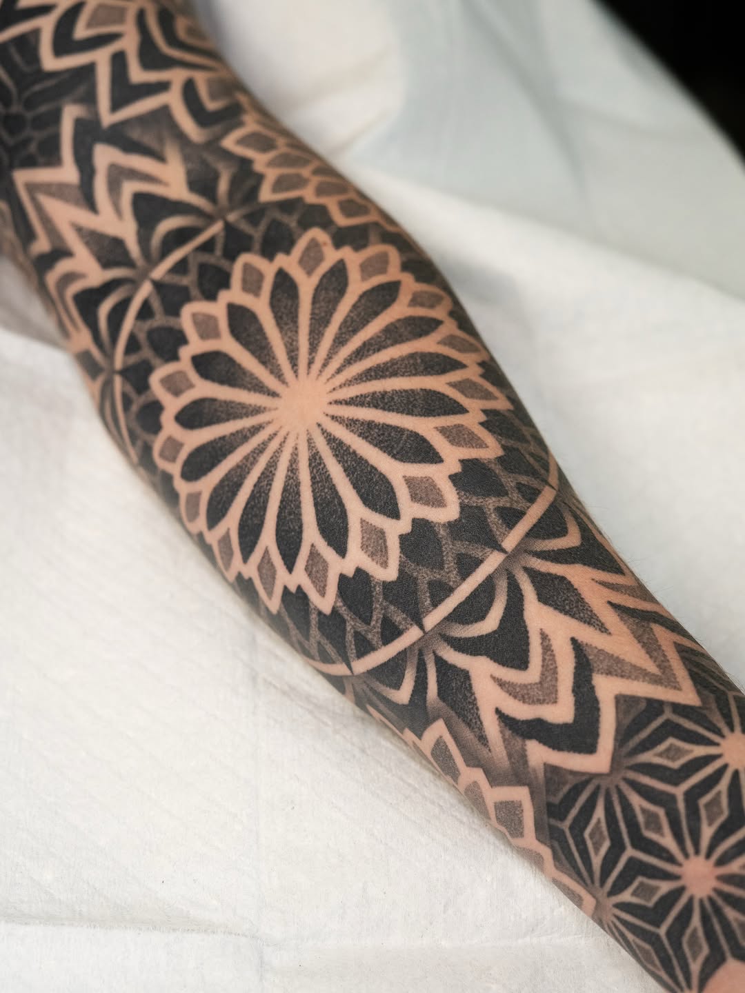 Tattoo by @rjxdots — geometric, dotwork