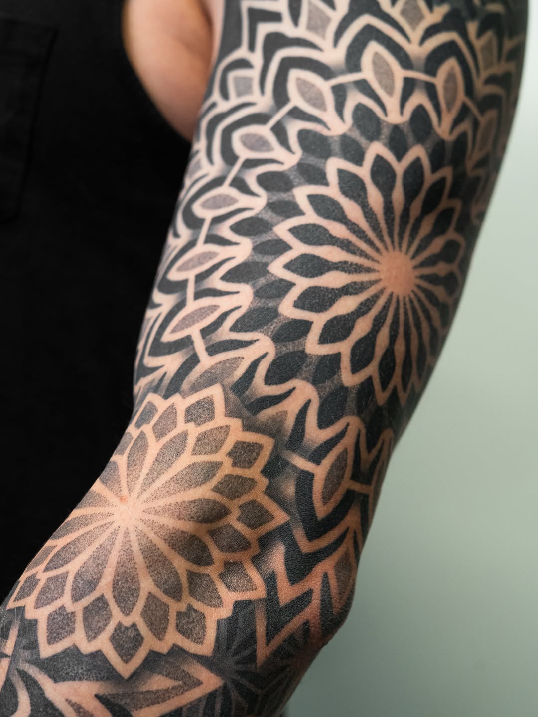 Tattoo by @rjxdots — geometric, dotwork