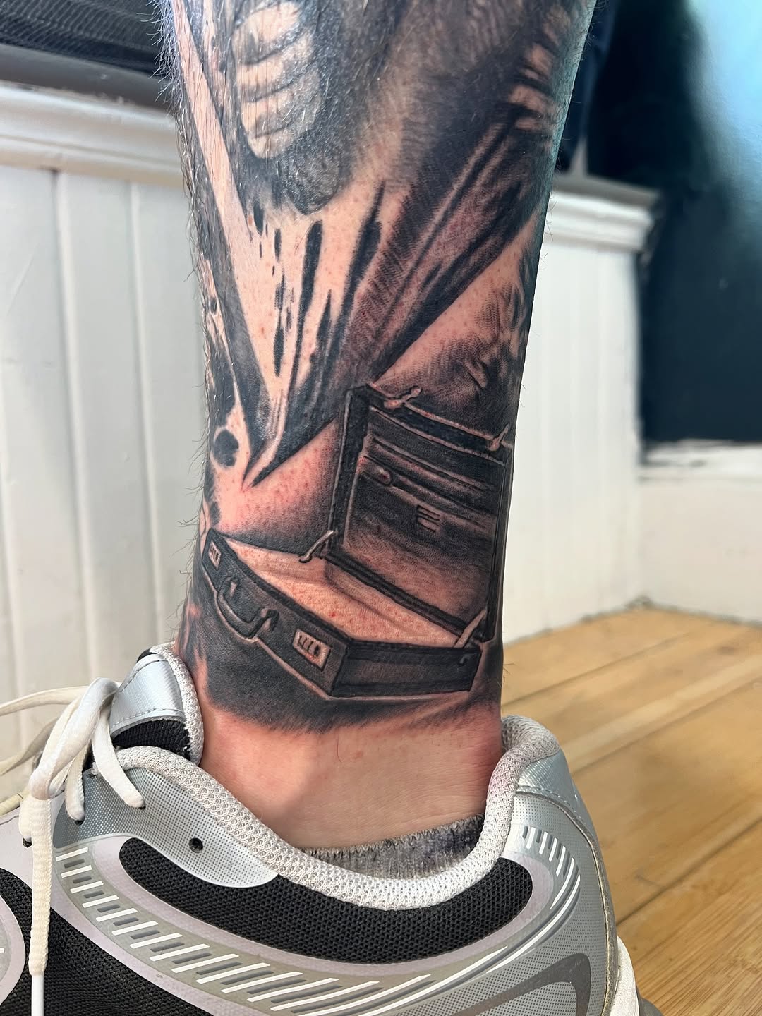 Tattoo by @strikt — realism, black_and_grey