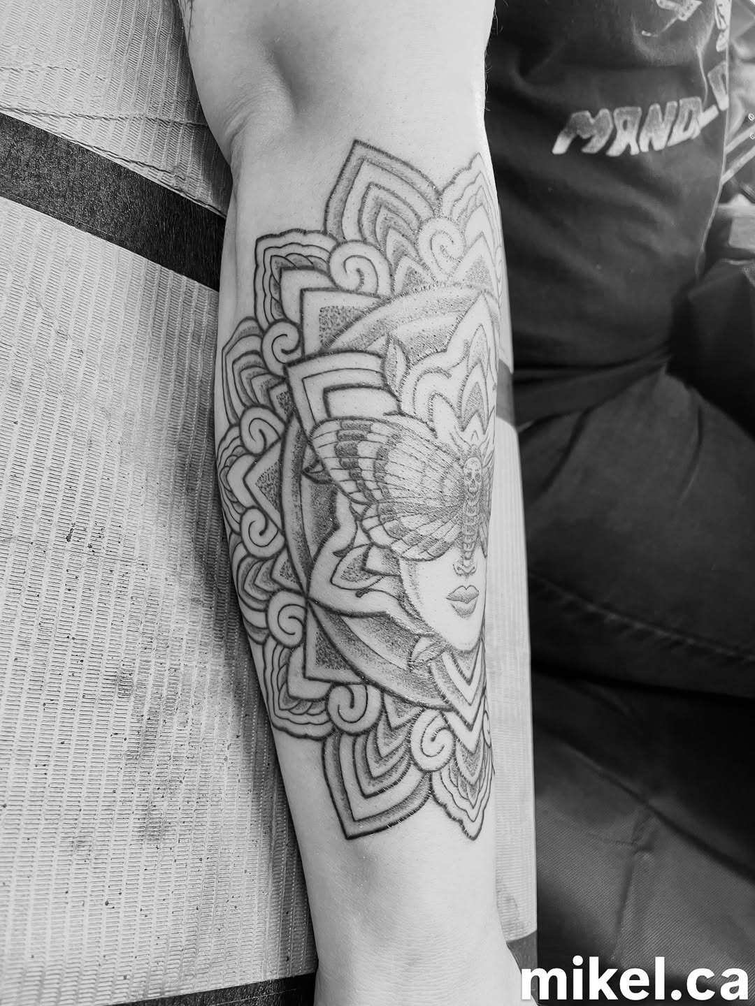 Tattoo by @mikel_tattoosangha — illustrative, dotwork