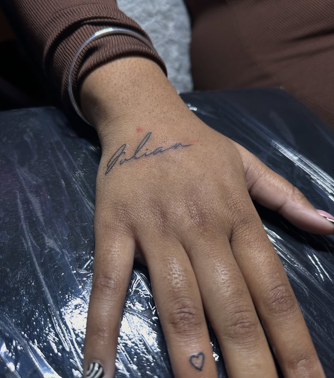 Tattoo by @chrisdoestattoos — lettering_script, fine_line