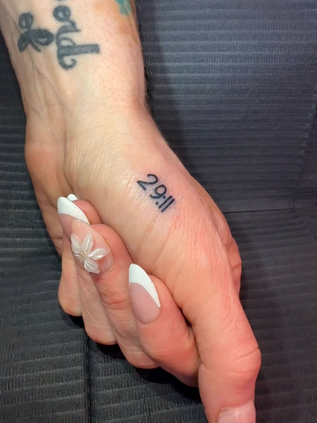 Tattoo by @riya.tatts.lv — lettering_script, minimalist