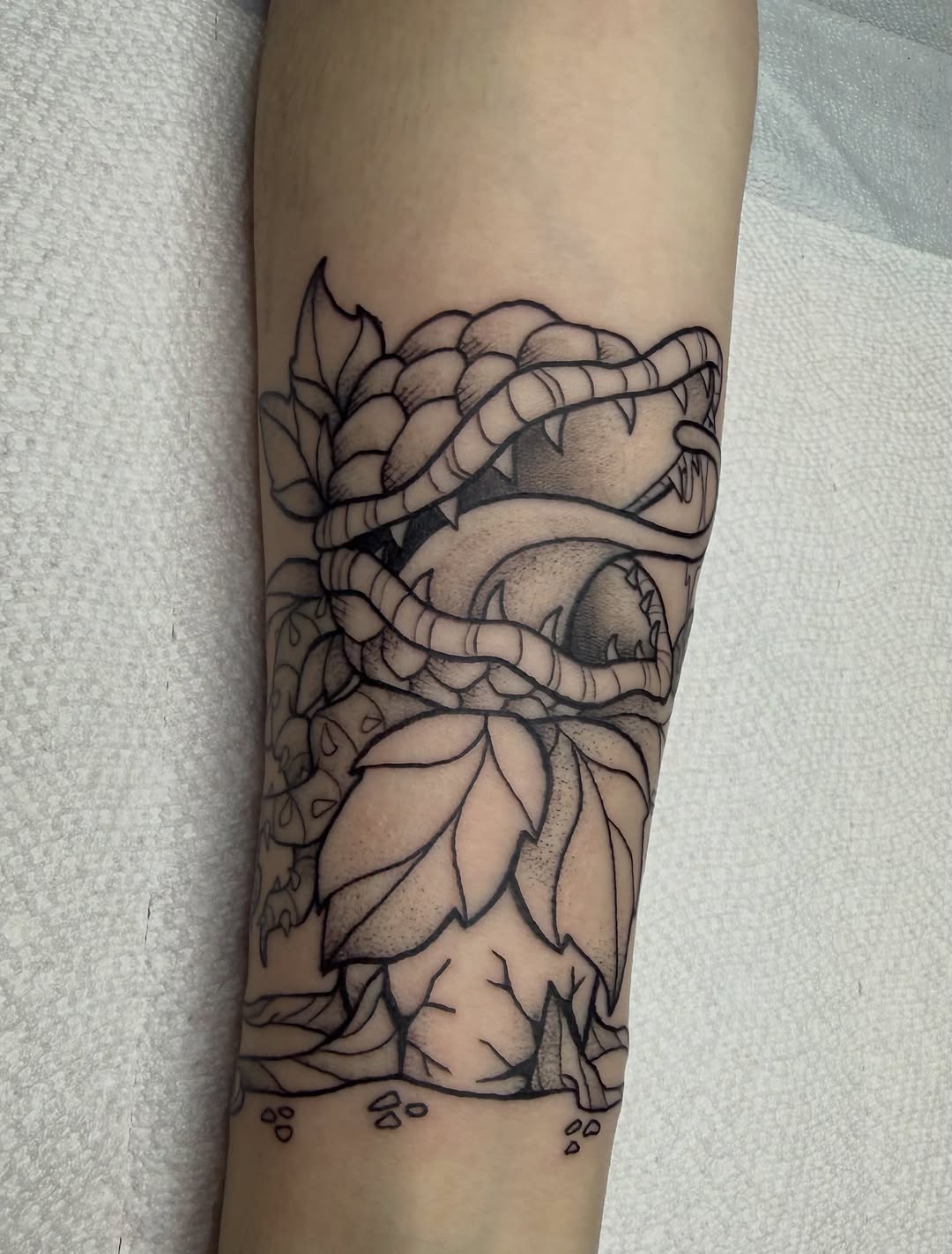 Tattoo by @glittergutstattoos — illustrative, blackwork