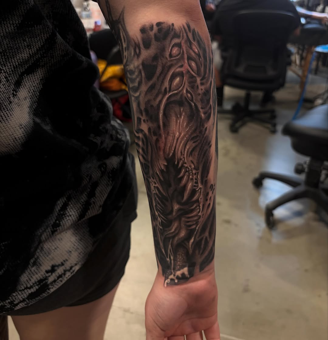 Tattoo by @inkedbycahela — black_and_grey, dark_realism