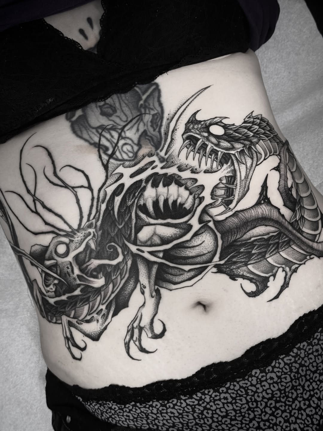 Tattoo by @bryanblack.ttt — black_and_grey, dotwork