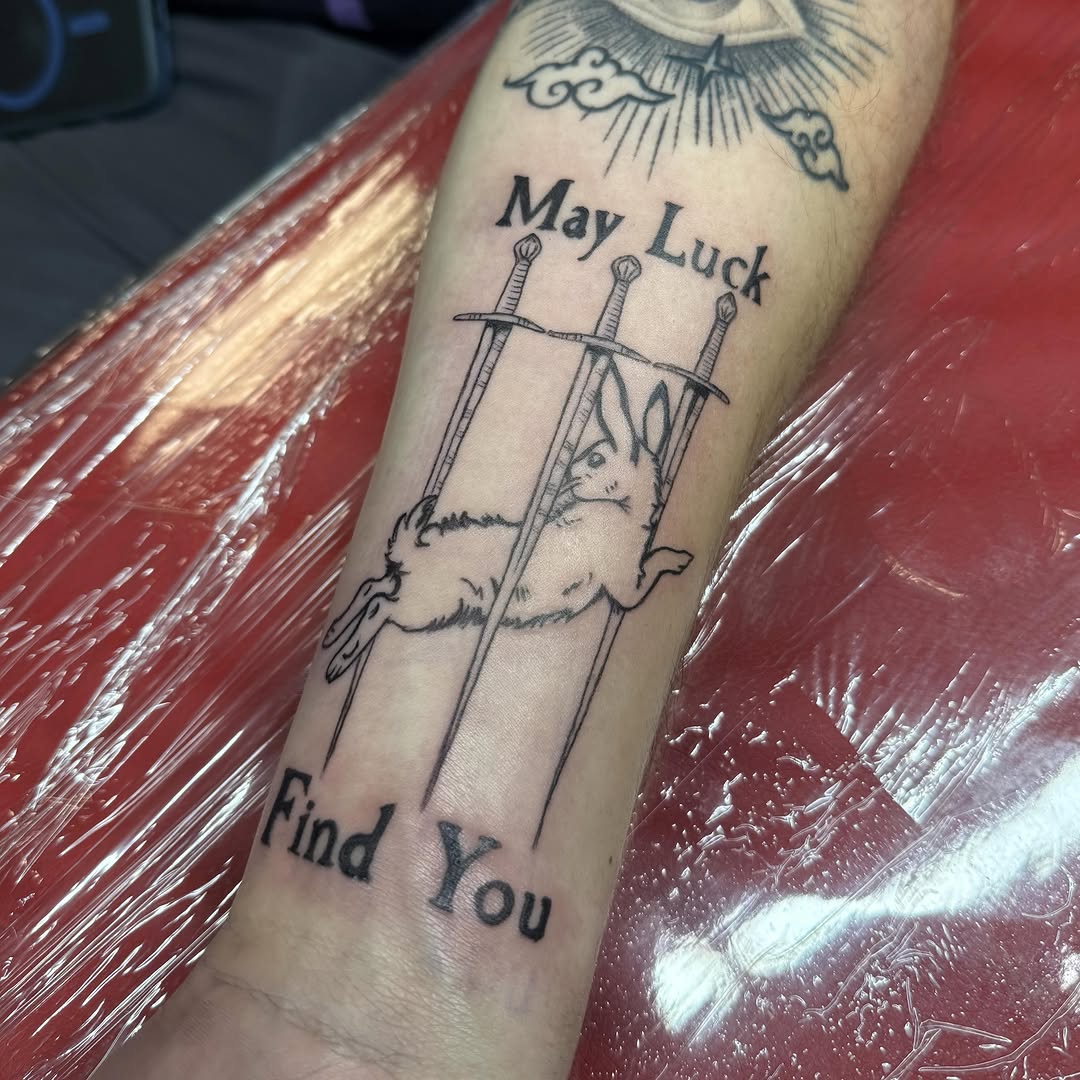 Tattoo by @paigeof.swords — lettering_script, illustrative