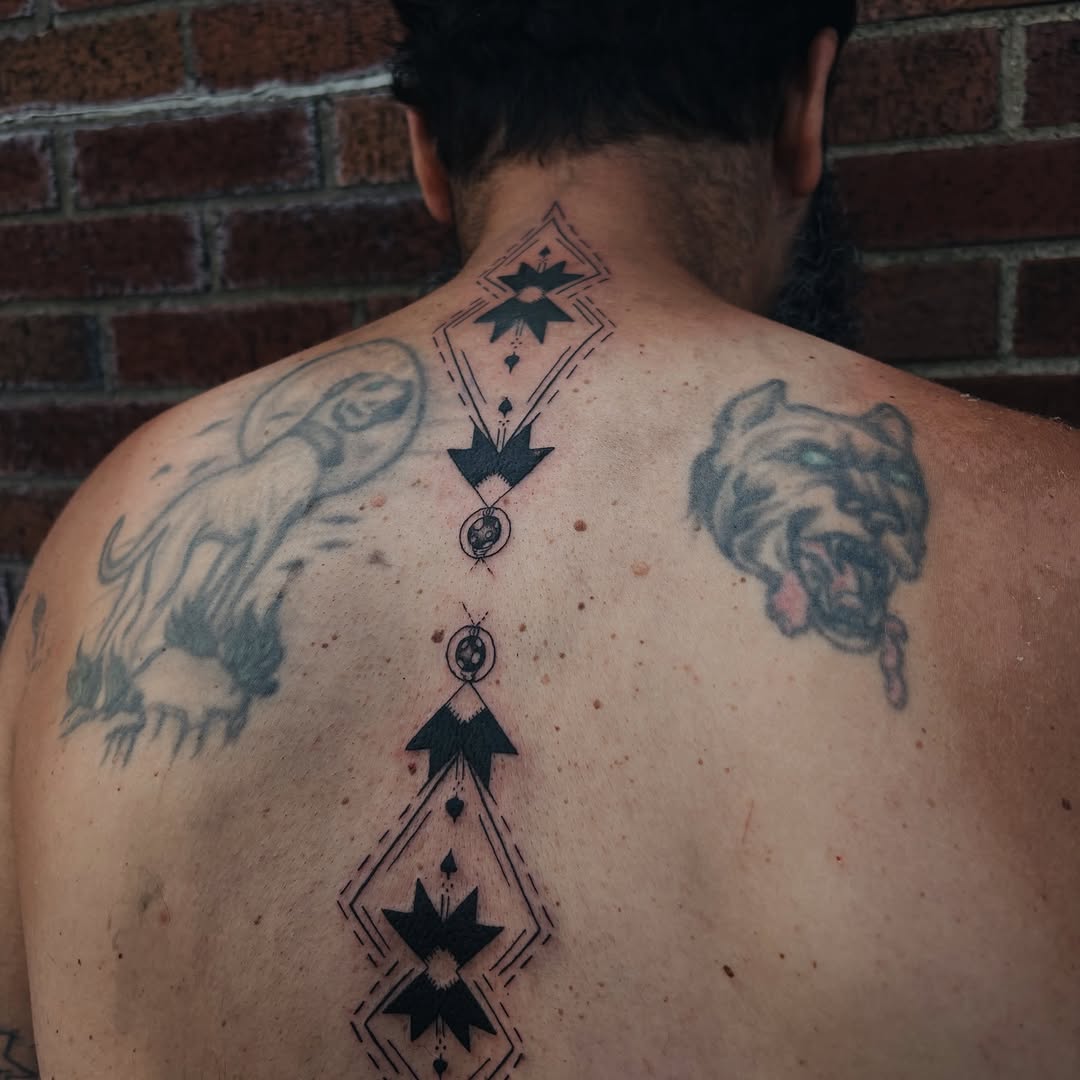 Tattoo by @embodied_tattoo — geometric, blackwork