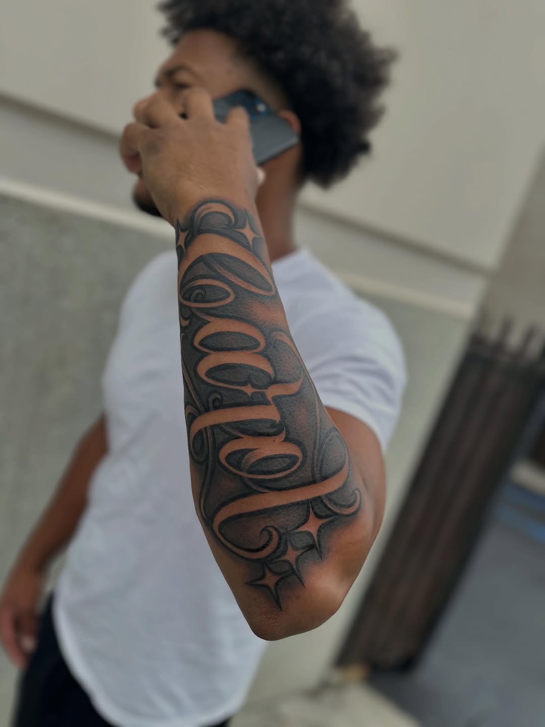 Tattoo by @rubenruiz_tattoos — lettering_script, black_and_grey