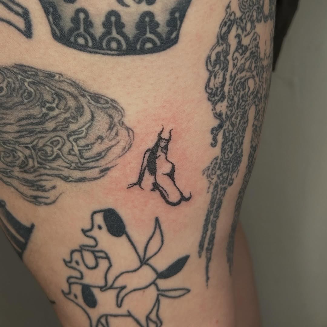 Tattoo by @glittergremliin — illustrative, blackwork