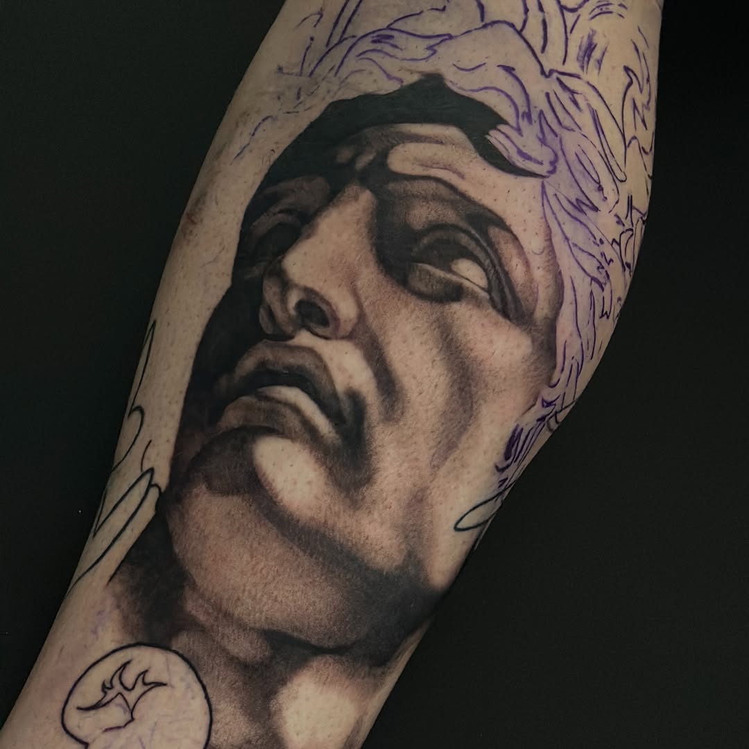 Tattoo by @tattooz_by_trent — realism, black_and_grey